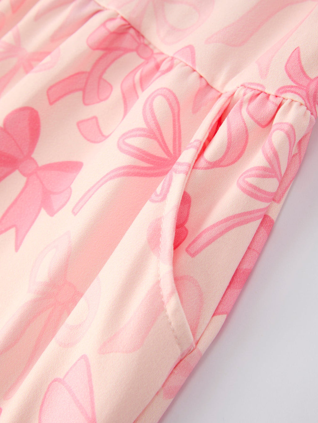 Brielle - Girl's Pink Bow Print Long Sleeve Jumpsuit